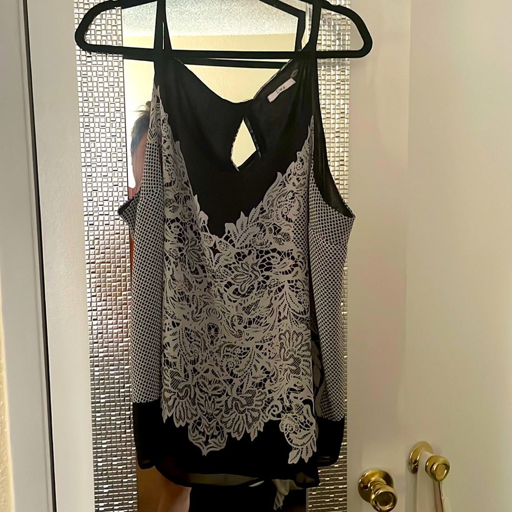 Black and white tank top by DEX.